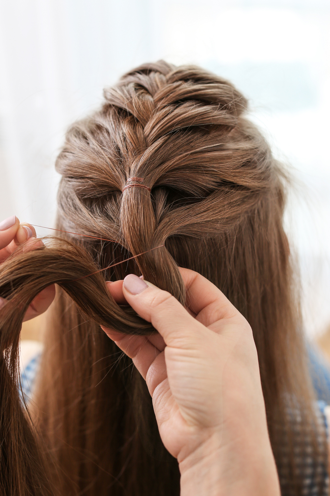 Hairdresser Making Braid Hairstyle to Woman 